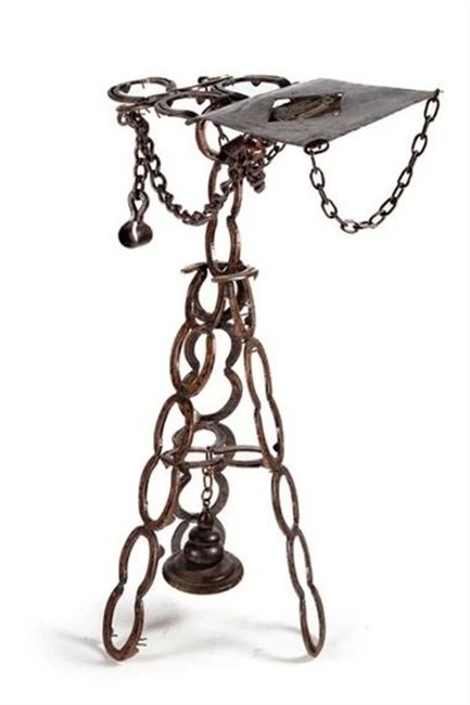 Lectern sculpture made of horseshoes